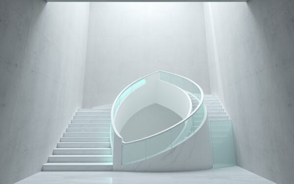 Escalier en marbre blanc spiralé éclairé par des accents vert émeraude dans un studio éditorial épuré
